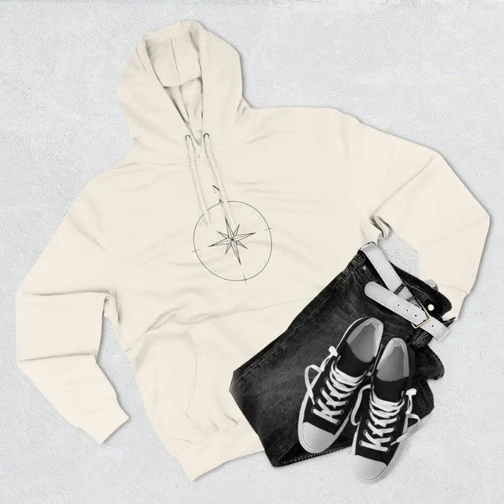 Cream-colored Cozy Compass Unisex Hoodie with adjustable hood and low heat fleece for travel and casual wear