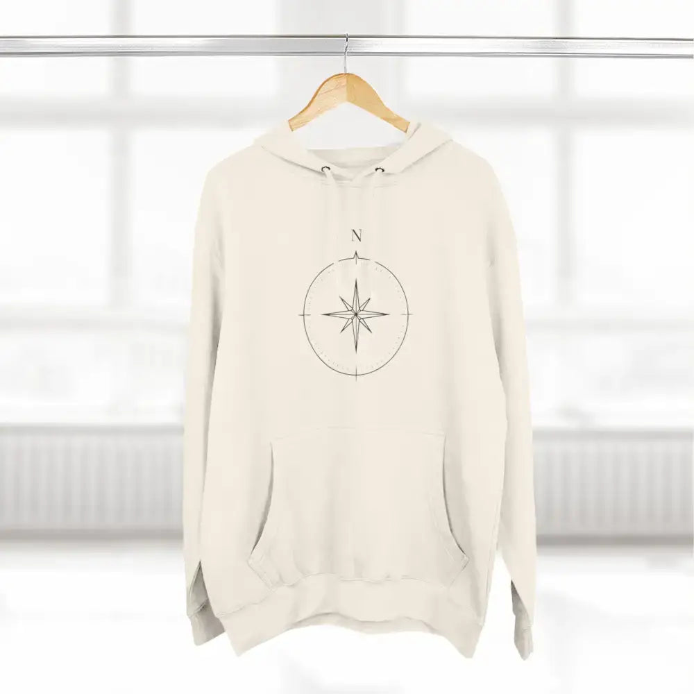 Off-white Cozy Compass Unisex Hoodie with compass rose design, adjustable hood, easy care