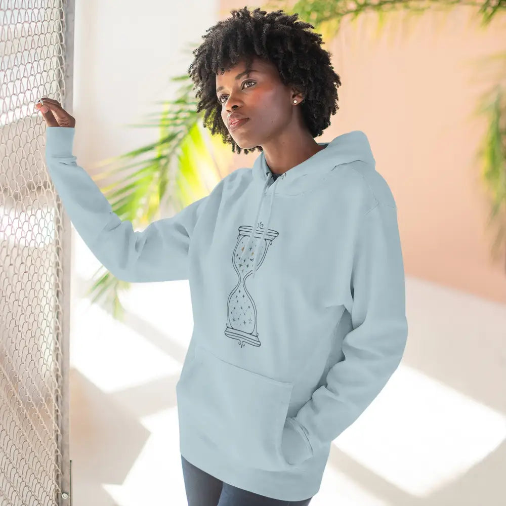Light blue fleece hoodie with hourglass graphic, perfect for all seasons and easy care