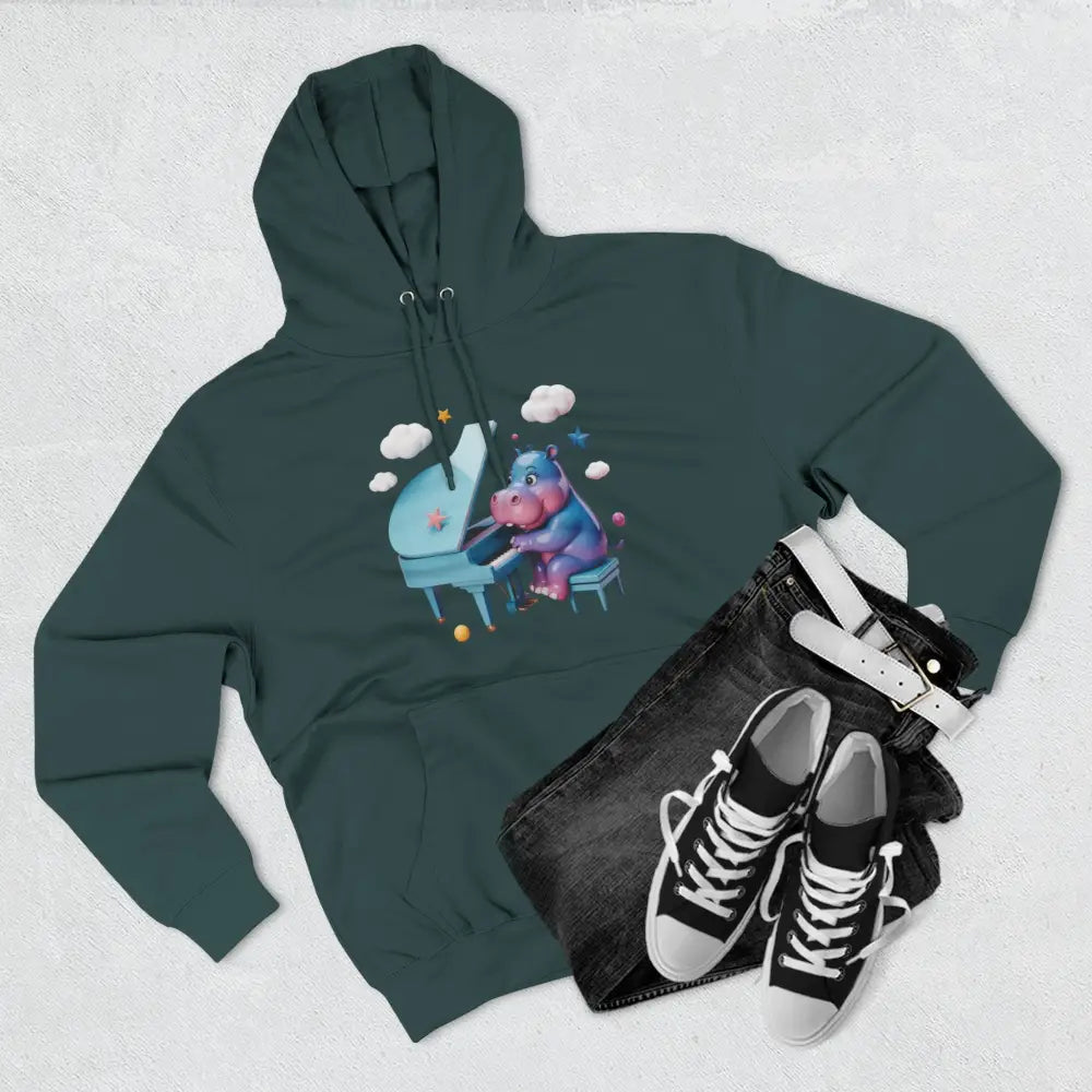 Dark teal fleece hoodie with whimsical purple hippo playing light blue piano and starry clouds