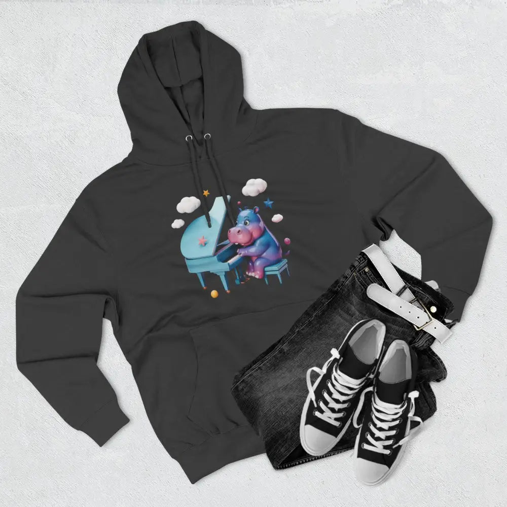 Dark grey fleece hoodie with colorful cartoon hippo playing a light blue piano, perfect for kids and teens