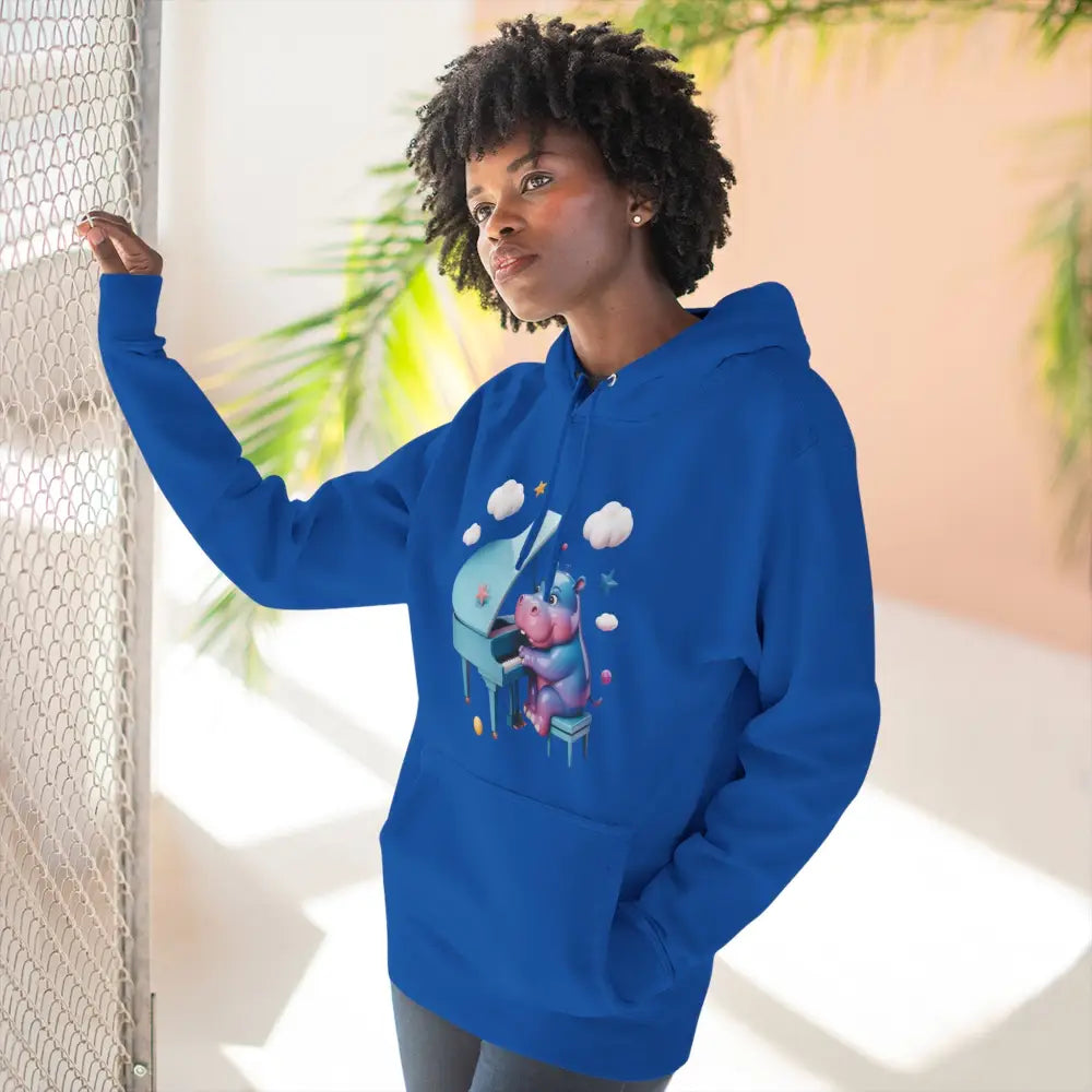 Woman in a blue graphic fleece hoodie from Cute Hippo Piano Fleece Unisex Hoodie
