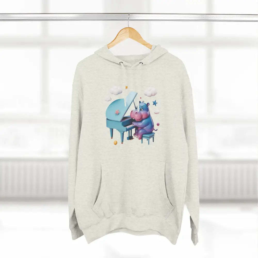 Cream-colored fleece hoodie with a hippopotamus playing a blue piano, perfect for music lovers