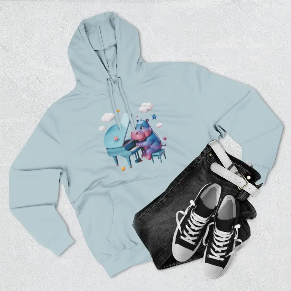 Light blue fleece hoodie with a cartoon hippo playing piano, perfect for music lovers