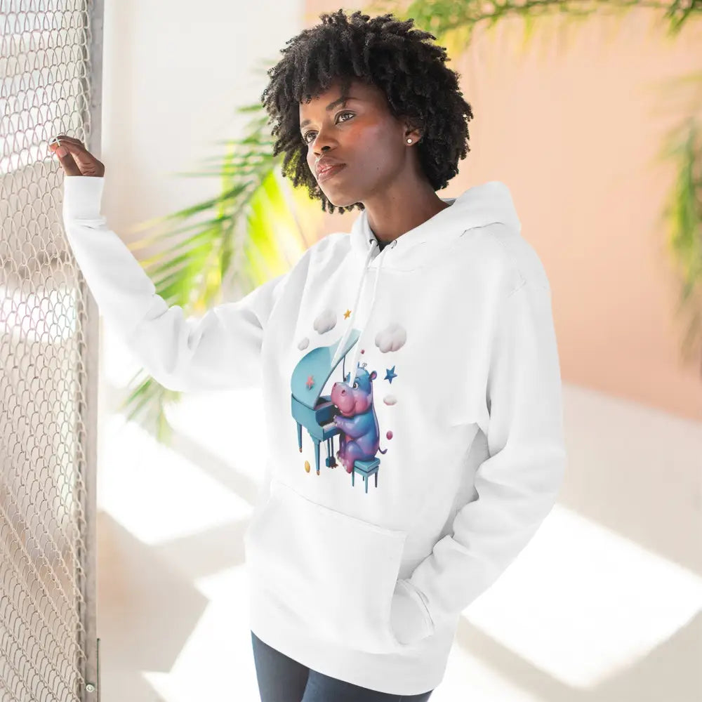 White fleece hoodie with a pink and blue hippo playing piano, perfect for music lovers