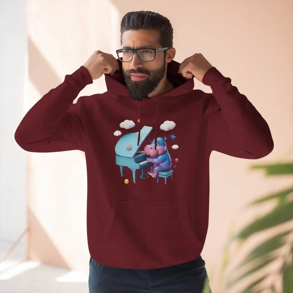 Maroon fleece hoodie featuring a cartoon hippo playing piano, perfect for music lovers