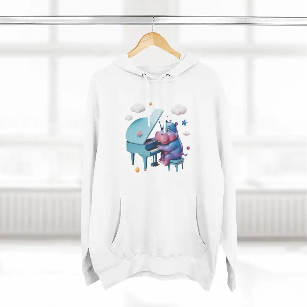 White fleece hoodie with playful cartoon hippo playing blue piano, cozy and delightful fleece hoodie for kids and teens