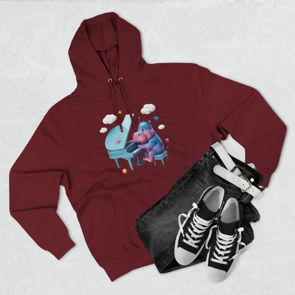 Maroon fleece hoodie with cartoon hippo playing piano, perfect for music lovers and kids