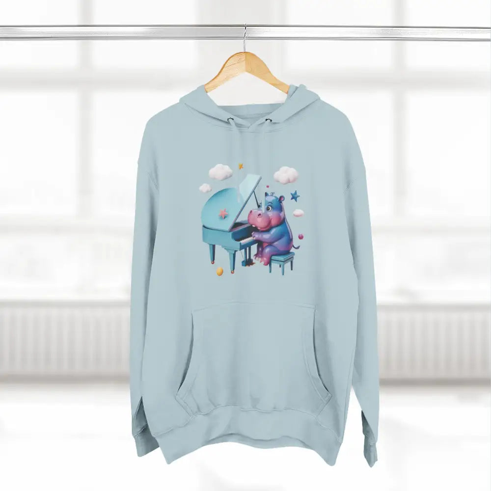 Light blue fleece hoodie with a hippopotamus playing piano, perfect for music lovers