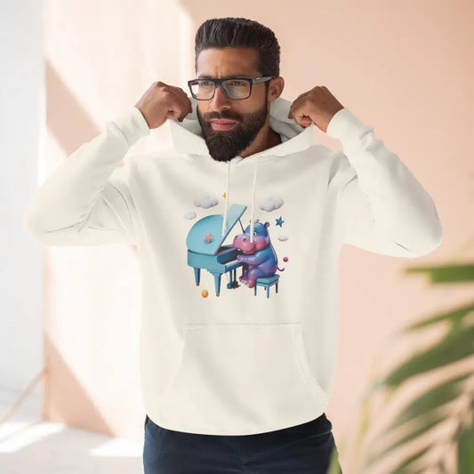 Man in a cream-colored fleece hoodie with a cartoon hippo playing piano, perfect for music lovers
