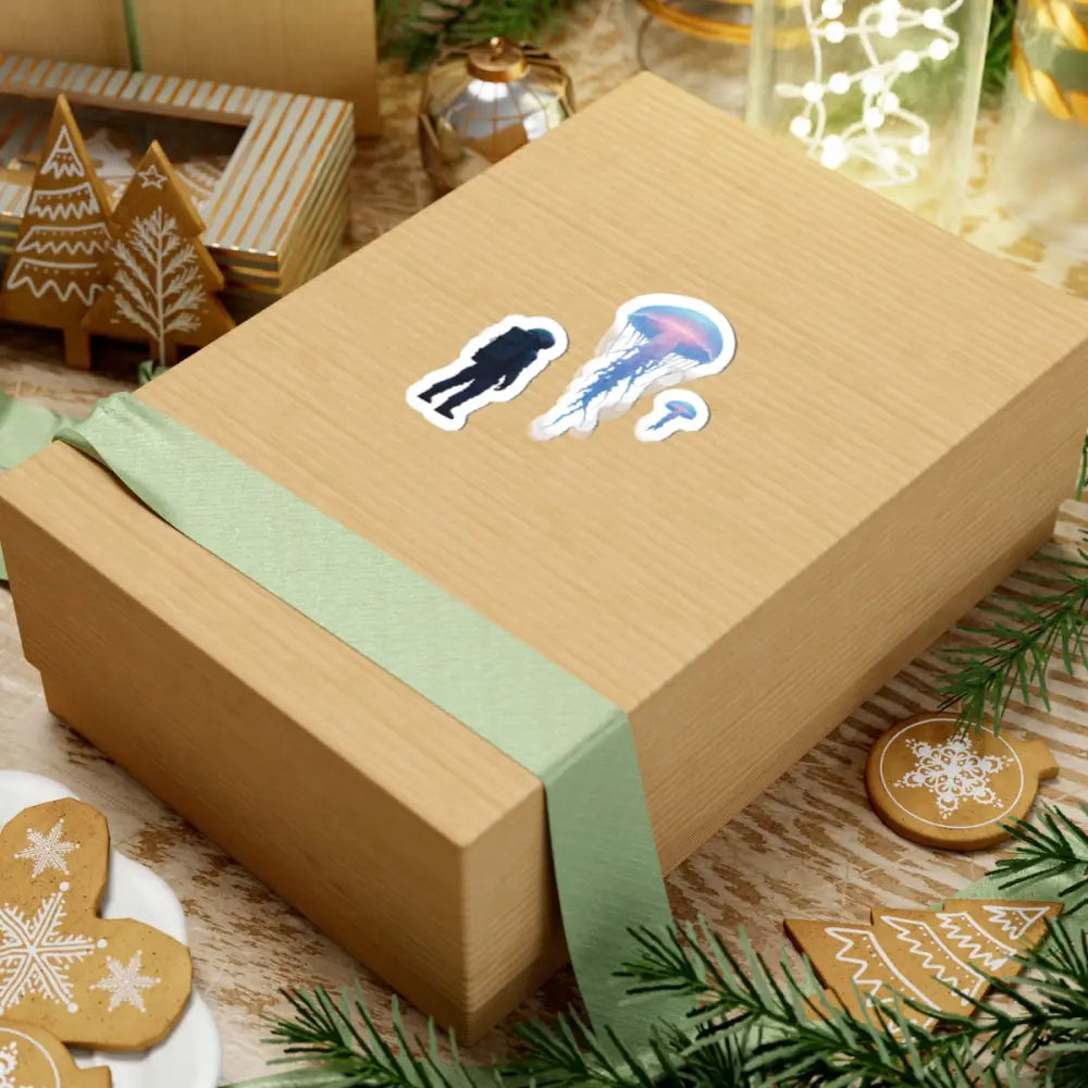 Wrapped gift box with Deep Drift Encounter Sticker featuring Astronaut and Jellyfish design