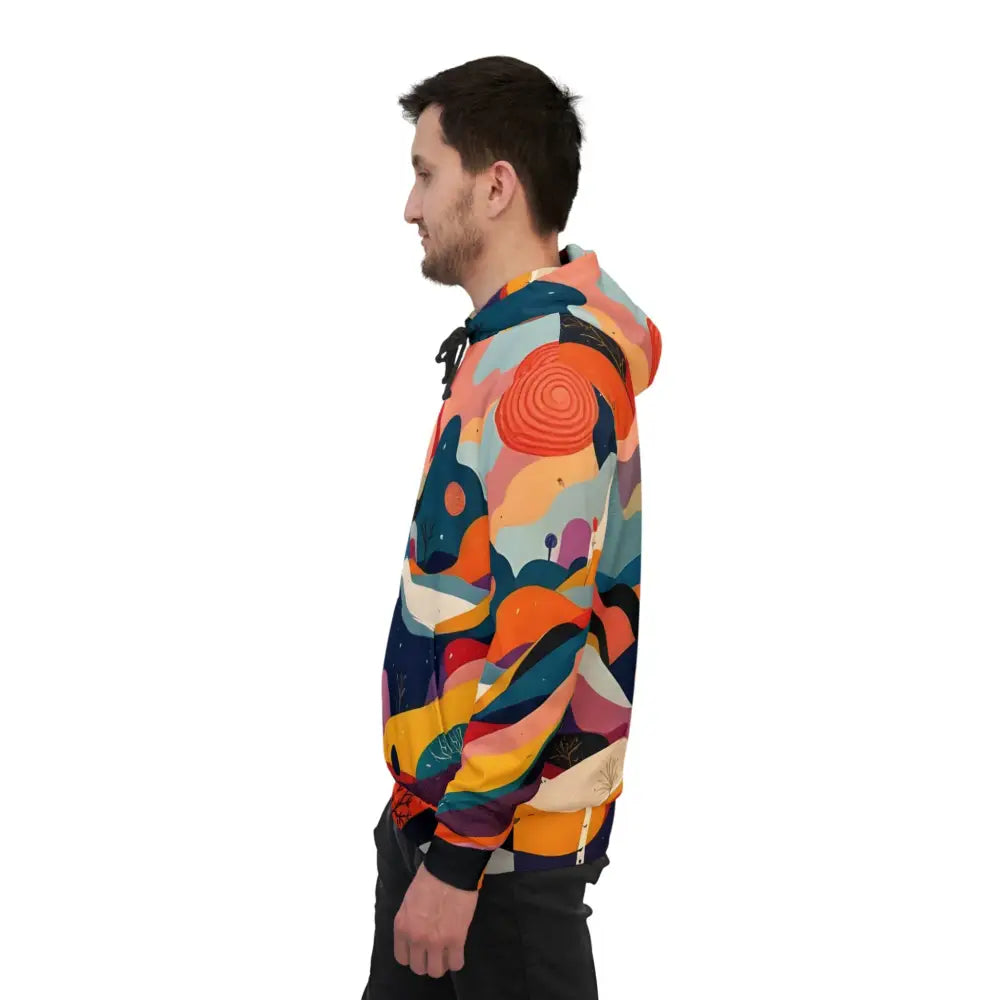 Man wearing a colorful patterned Flowstate Mirage Urban Camo Hoodie for Festival Wear