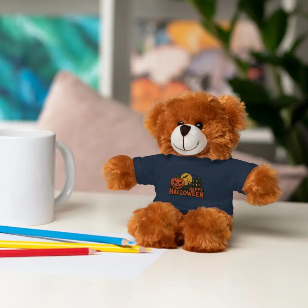 Brown teddy bear wearing dark blue Halloween tee with haunted house graphic, collectible plush