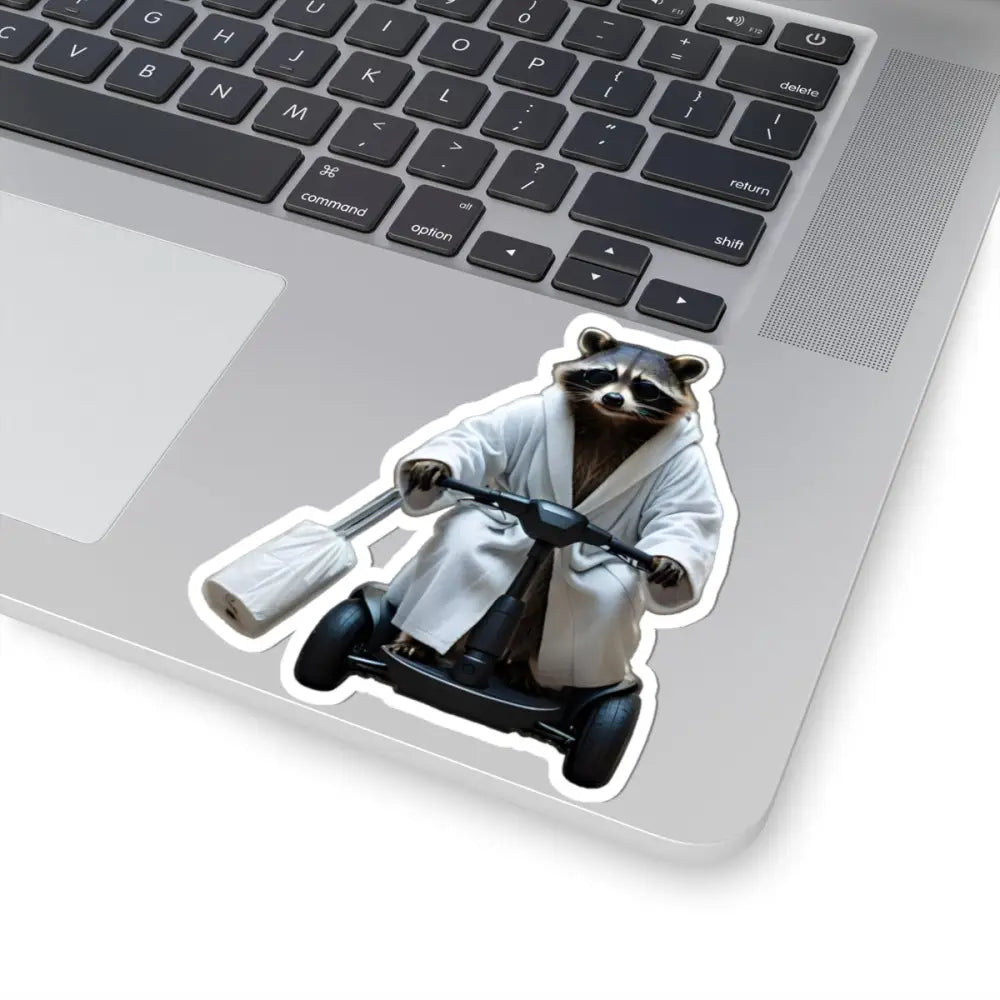 Raccoon in bathrobe riding a scooter sticker for Mobility Mogul decal