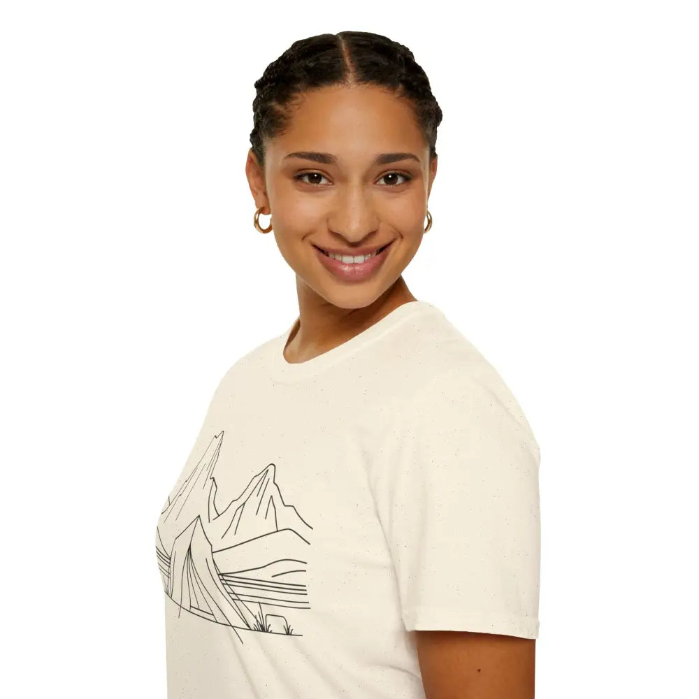 Smiling woman in a stylish unisex t-shirt with mountain graphic made from ring-spun cotton