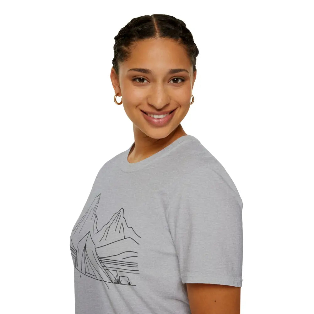 Young woman with braided hair wearing a stylish unisex t-shirt with mountain line drawing in ring-spun cotton