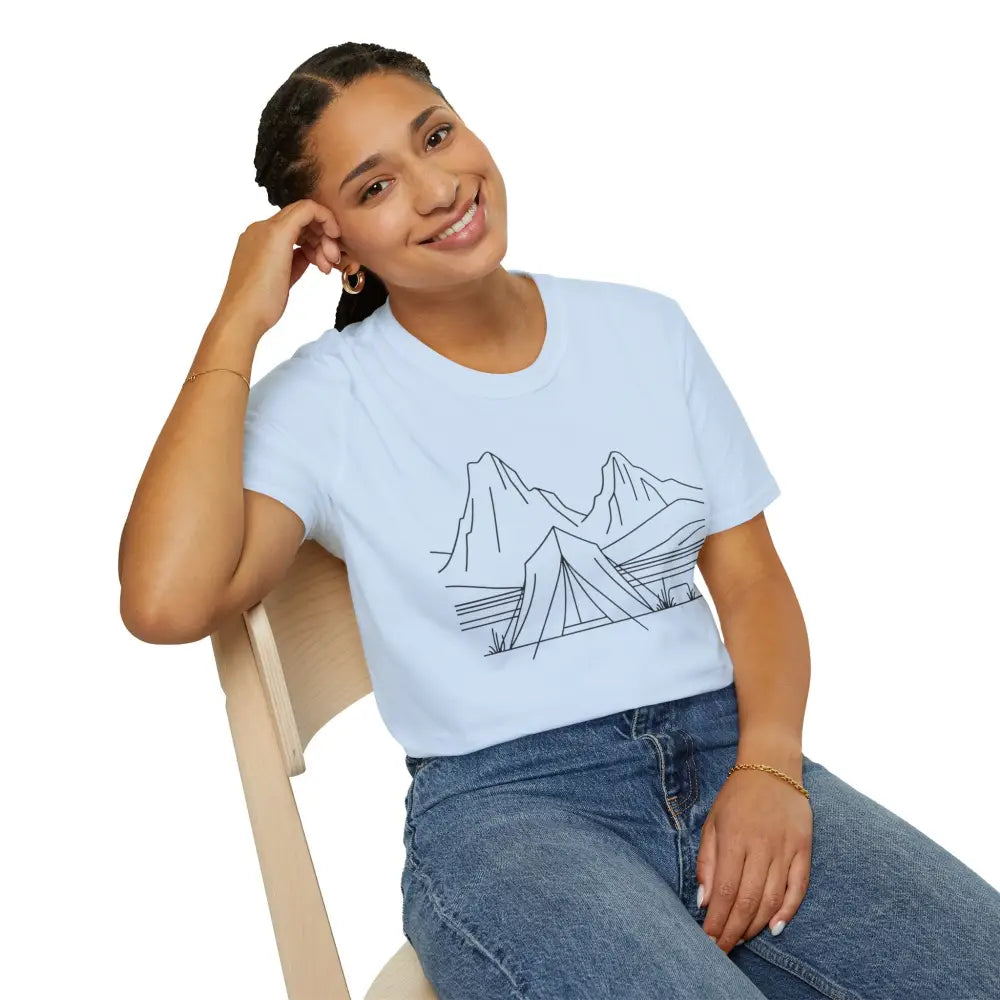 Woman wearing stylish unisex t-shirt with mountain and tent graphic, made from ring-spun cotton