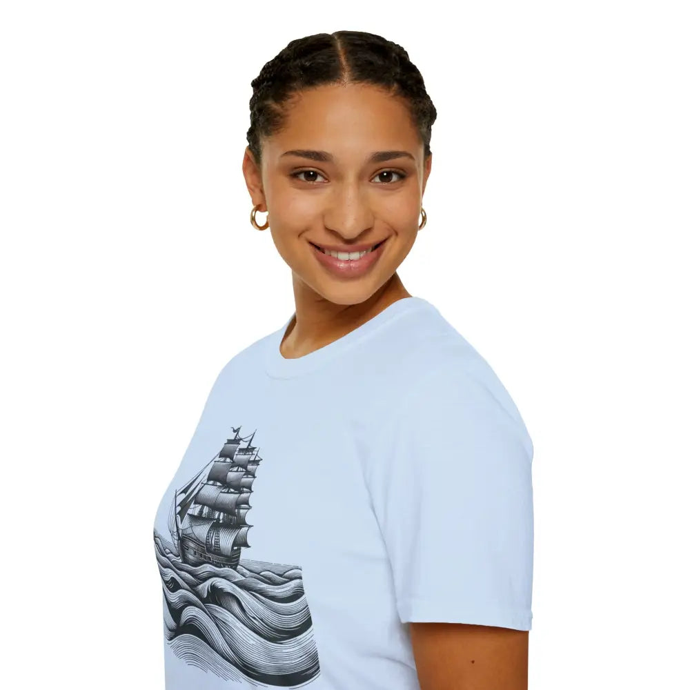 Smiling woman in a light blue Nautical Adventure unisex T-shirt with ship design and elastic ribbed collar