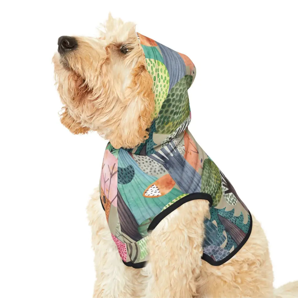Dog wearing a colorful woodland camo hooded jacket from PixiOnyx Bold Petwear