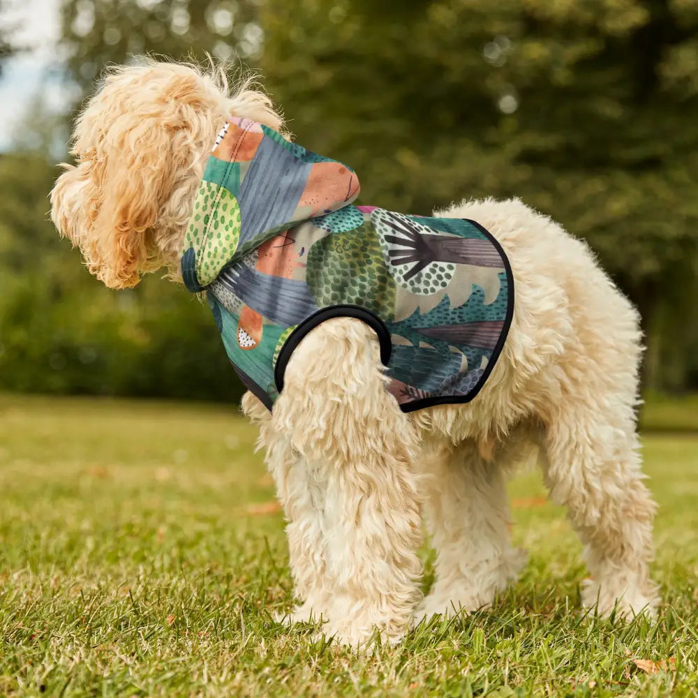 Dog wearing a colorful woodland camo patterned hoodie from PixiOnyx Bold Petwear