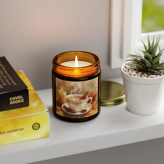 Lit candle in amber jar from PixiOnyx Aromatherapy with Cinnamon Chai scent