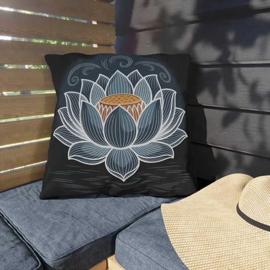 Black square throw pillow with stylized blue and white lotus flower, stunning outdoor pillow