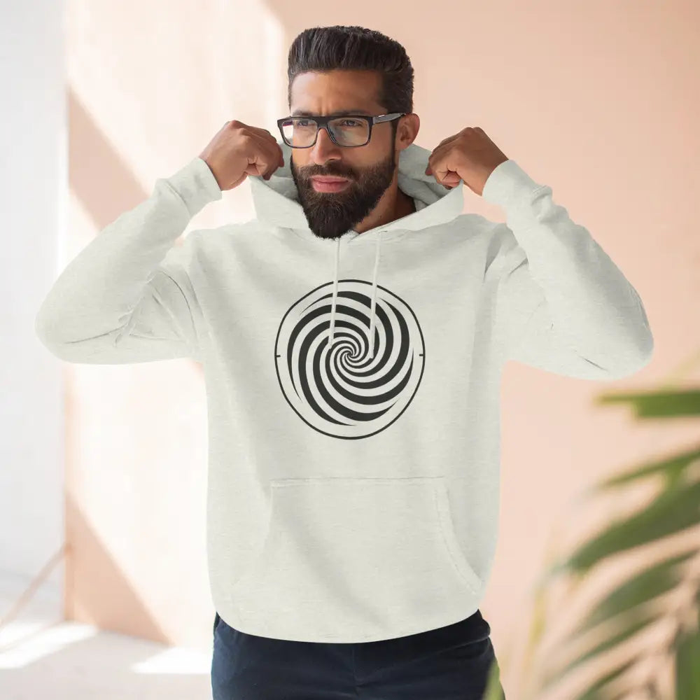 Man wearing off-white fleece hoodie with black and white spiral design and spacious kangaroo pocket