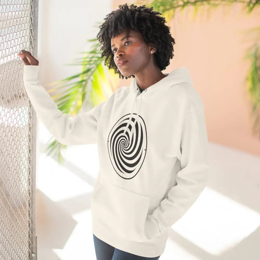 Black woman wearing white fleece hoodie with black swirl design and spacious kangaroo pocket