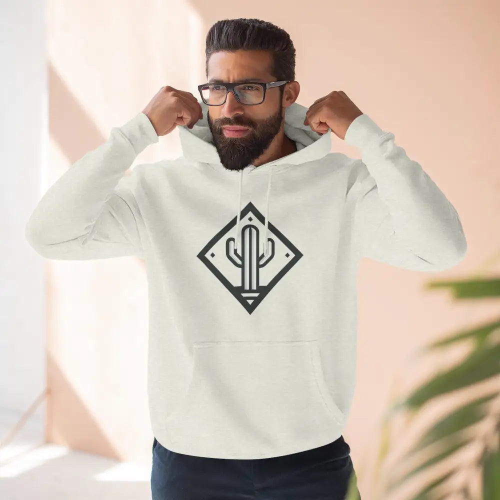 Bearded man wearing white hoodie with black cactus logo, cozy fleece with adjustable hood