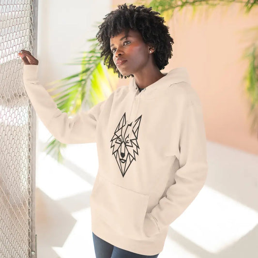 Woman wearing a stylish wolf graphic unisex hoodie with black geometric design for outdoor adventures