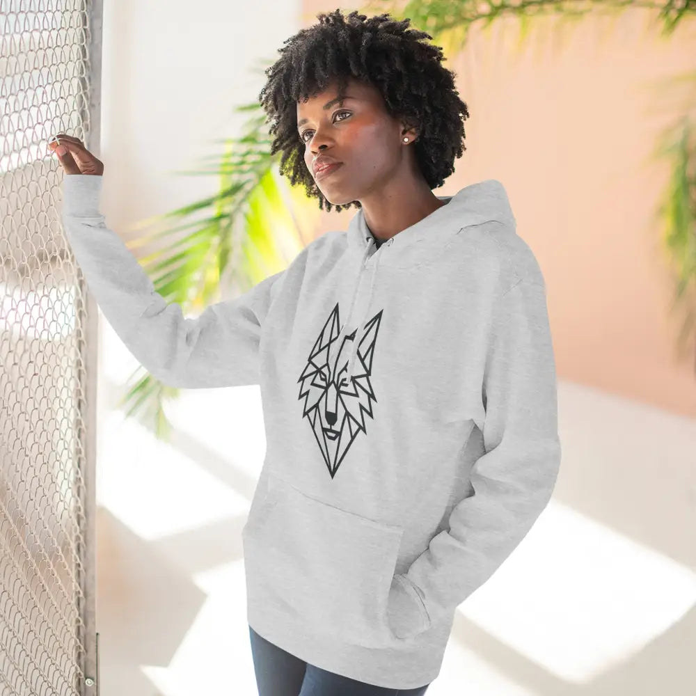 Woman wearing a stylish wolf graphic unisex hoodie perfect for outdoor adventures and winter fashion