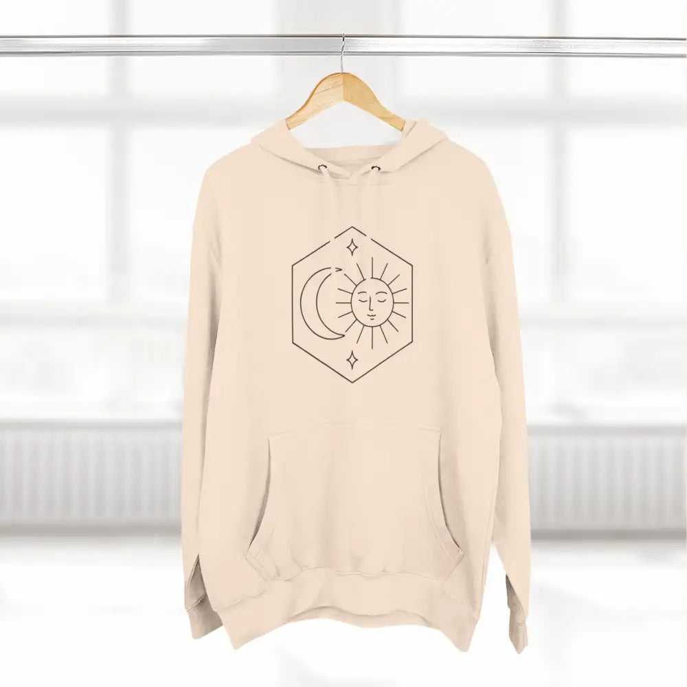 Light beige unisex fleece hoodie with sun and moon celestial graphic for cozy style
