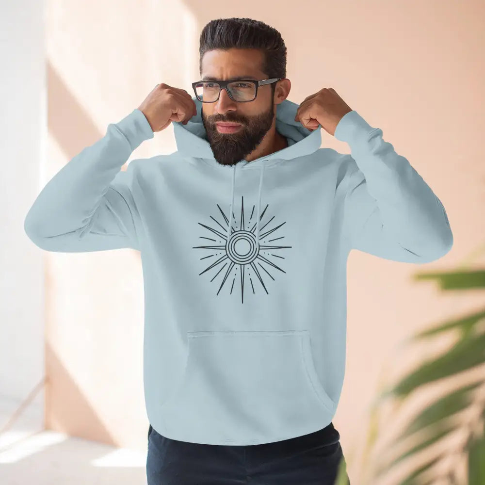Light blue fleece hoodie with sunburst graphic, spacious kangaroo pocket, cozy casual wear