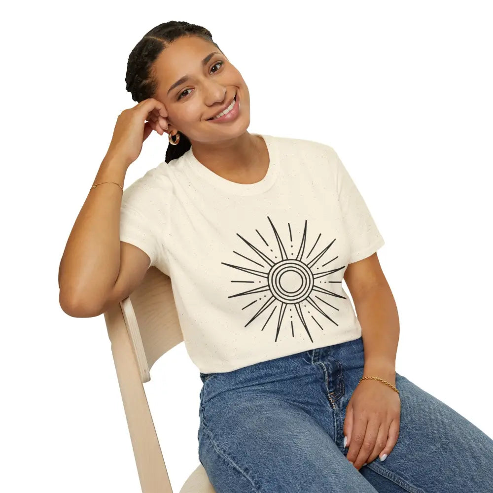 Woman wearing a cream-colored unisex softstyle Sunshine Graphic T-Shirt with sun design
