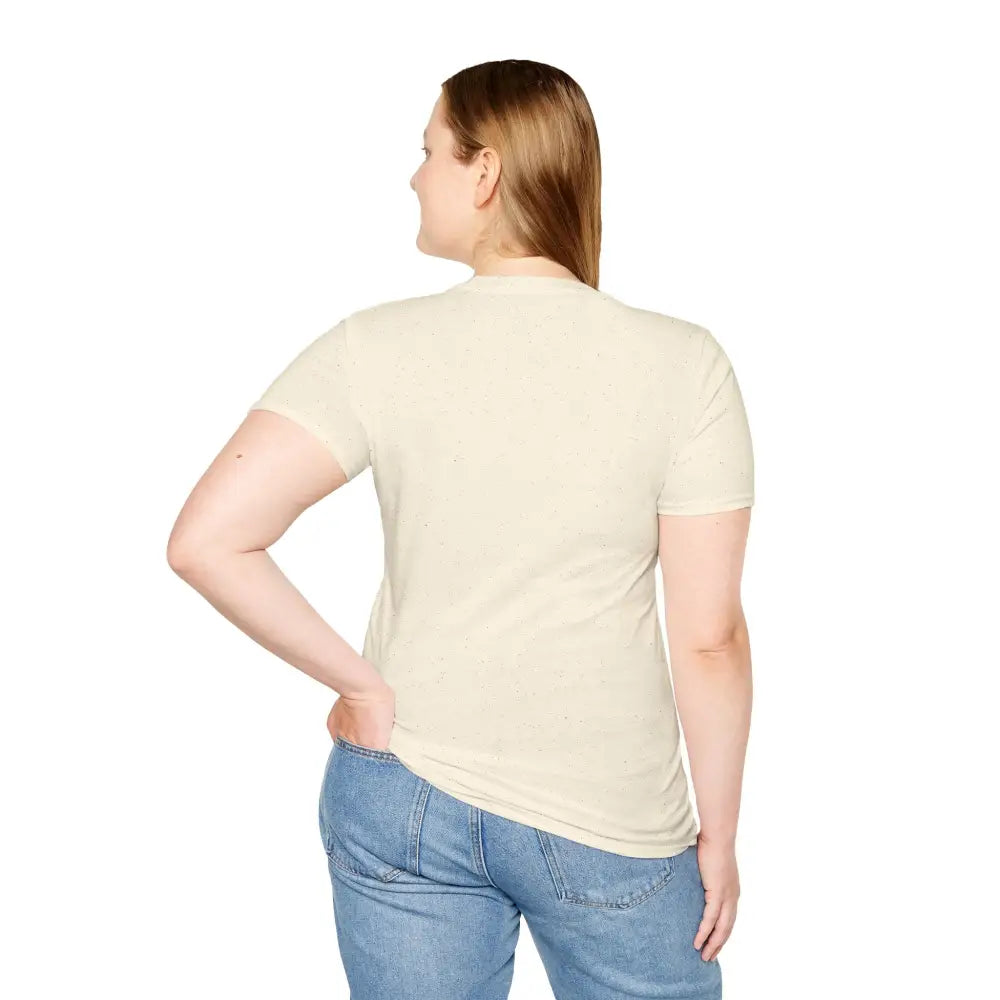 Plus-size woman in cream unisex softstyle T-shirt and blue jeans for outdoor adventure