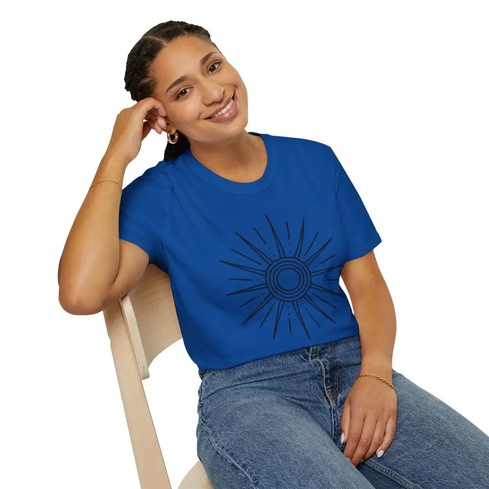 Woman in royal blue unisex softstyle crop top with sun design and blue jeans for summer outdoor wear