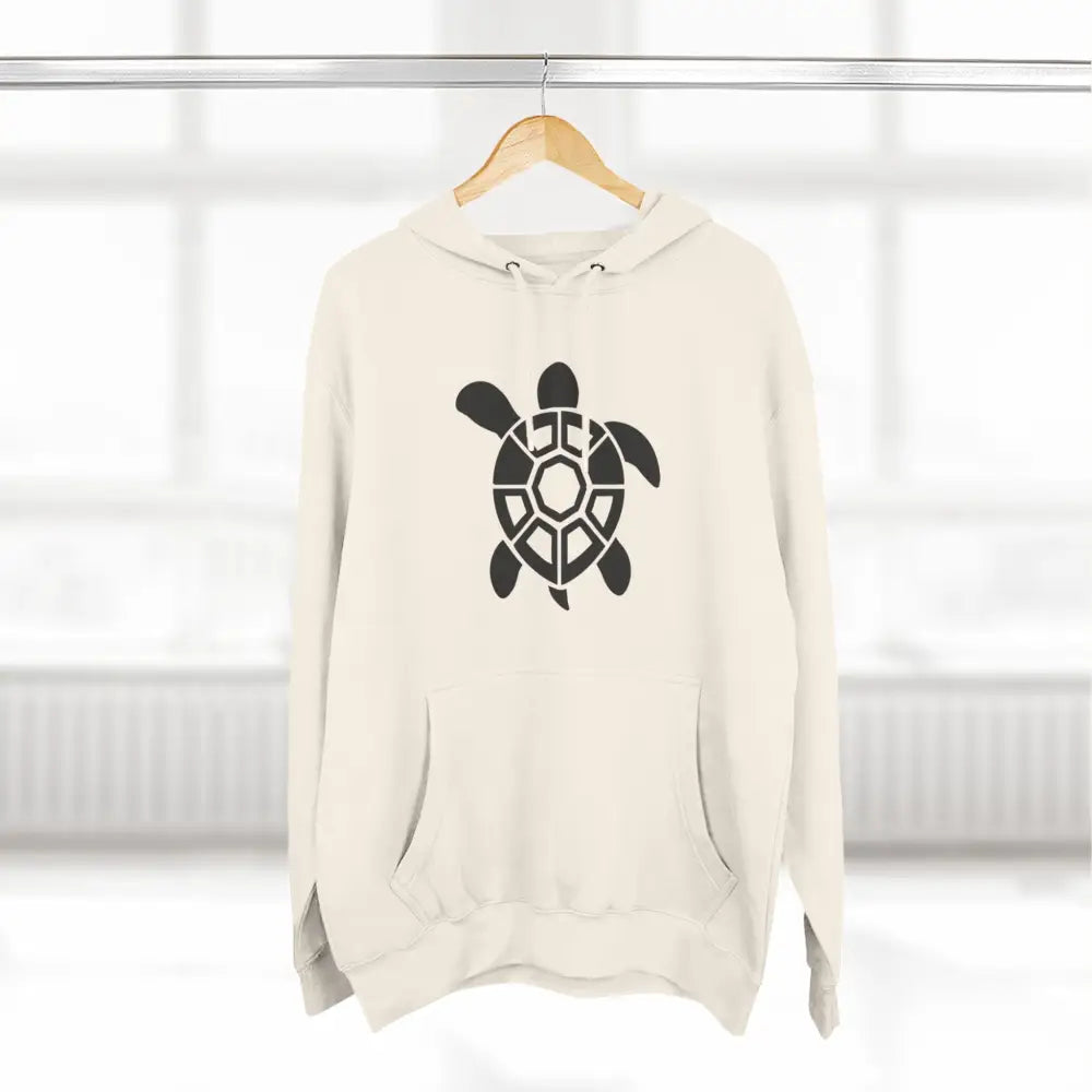 Off-white fleece hoodie with black tribal turtle graphic, perfect for casual outings