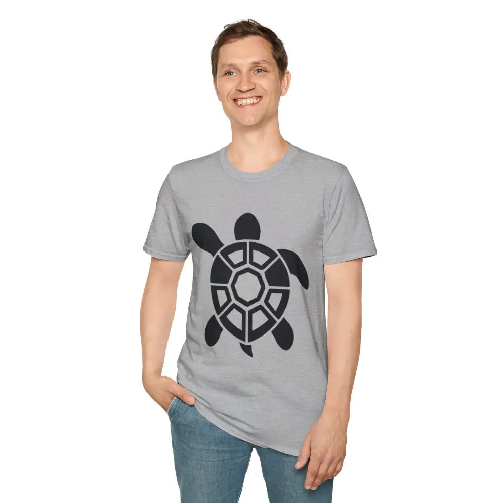 Smiling man wearing light gray Turtle Graphic Unisex Tee with black turtle design and blue jeans
