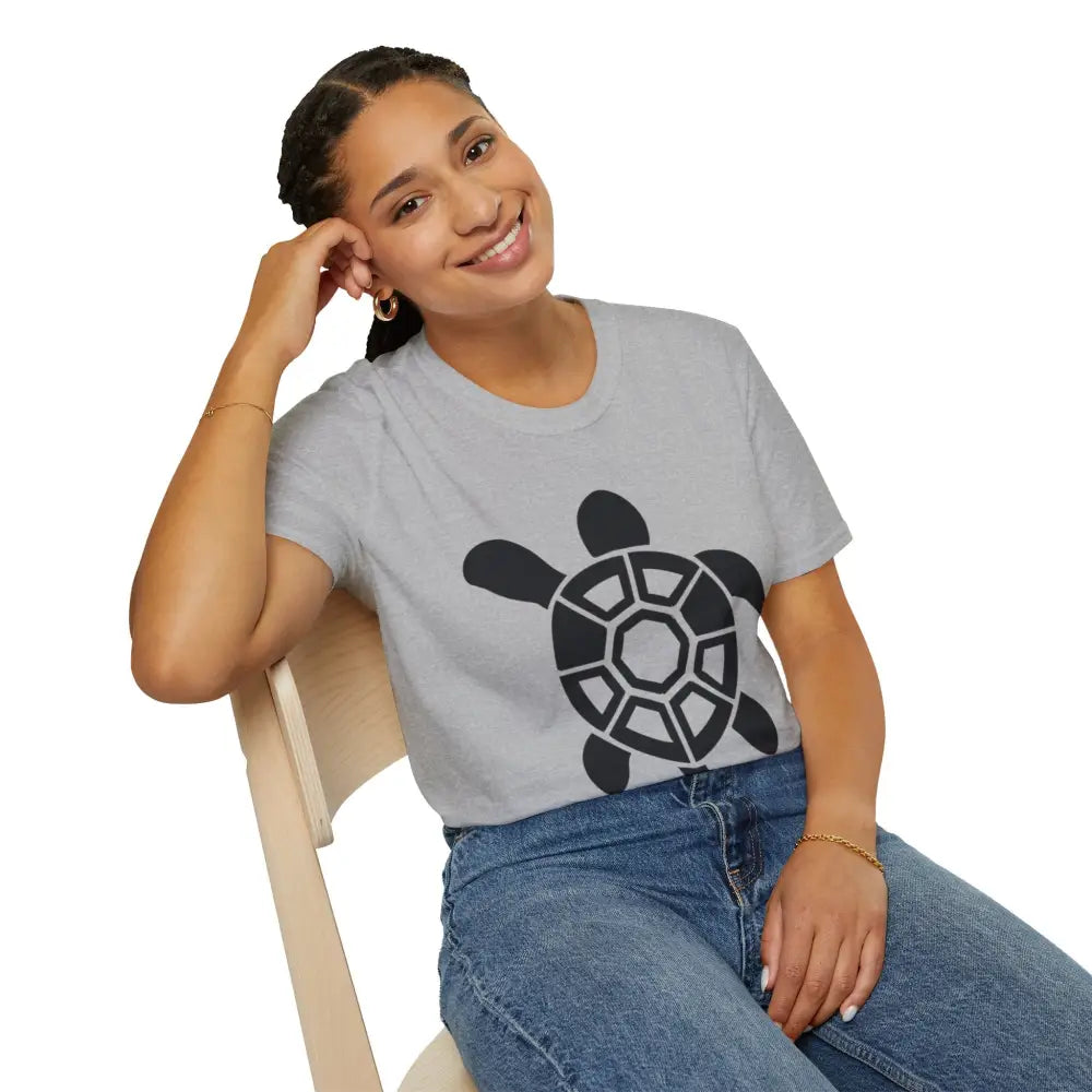 Woman wearing a light gray turtle graphic eco-friendly t-shirt with care instructions for low heat and tumble dry