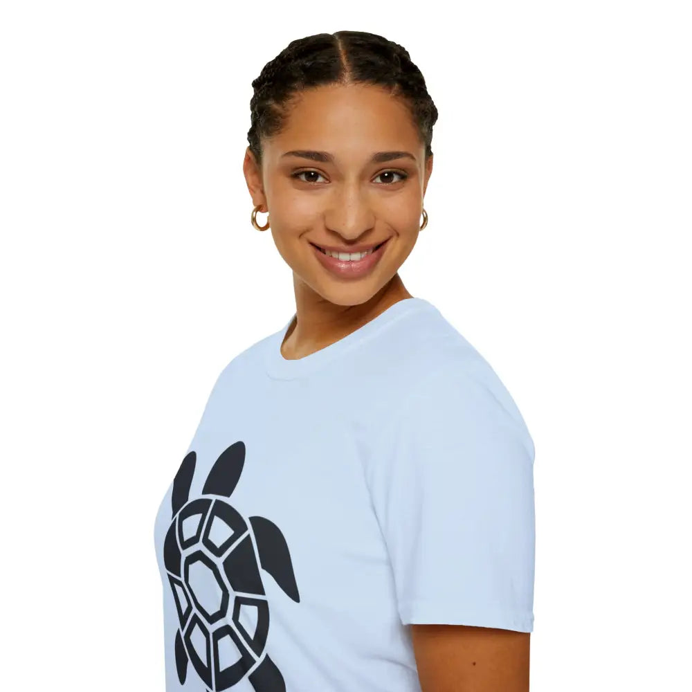 Smiling woman in light blue Turtle Graphic Unisex Tee showcasing eco-friendly casual wear