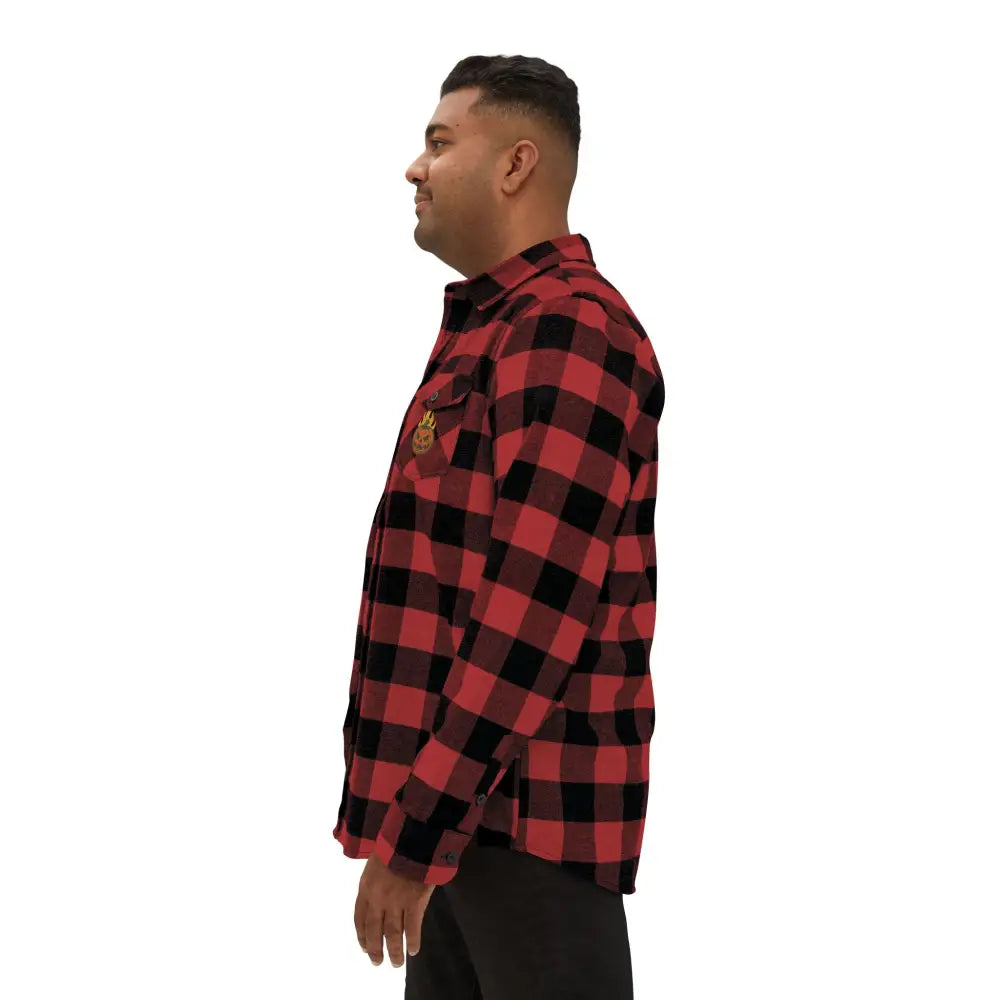 Unisex Flannel Shirt Flaming Pumpkin Halloween Edition worn by man, perfect for low heat comfort