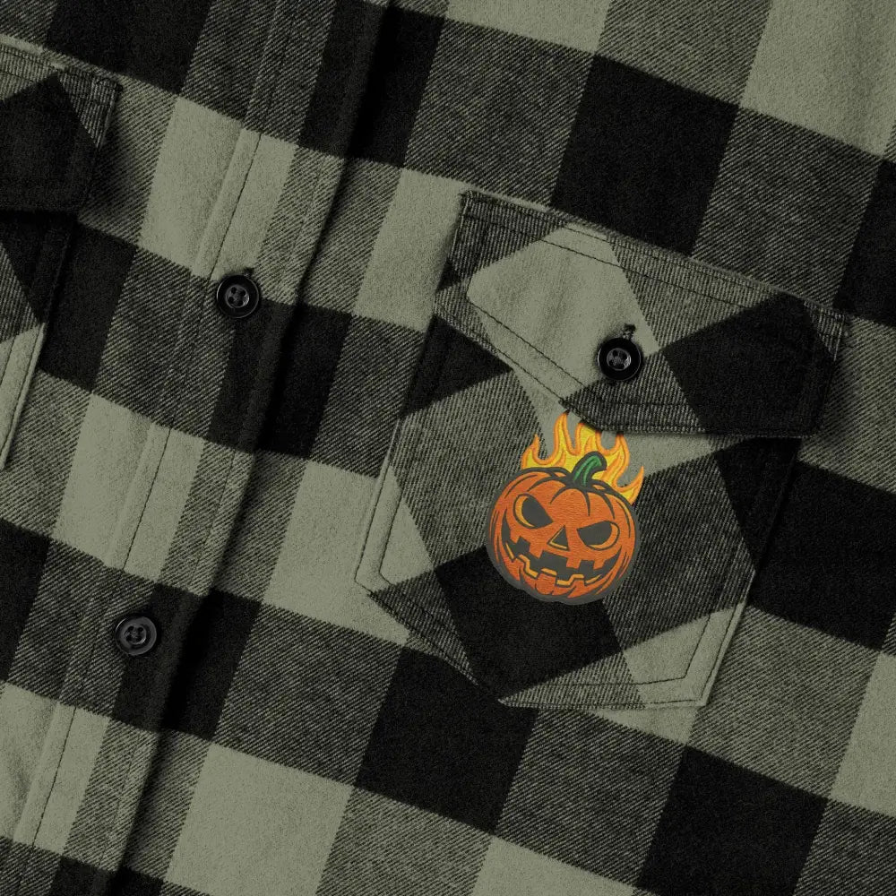 Olive green and black plaid flannel shirt with flaming pumpkin patch for Halloween style