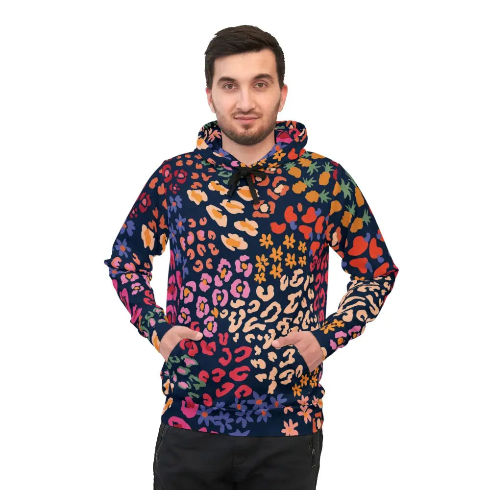 Man wearing colorful patterned hoodie from PixiOnyx Chromapulse Spots Streetwear collection