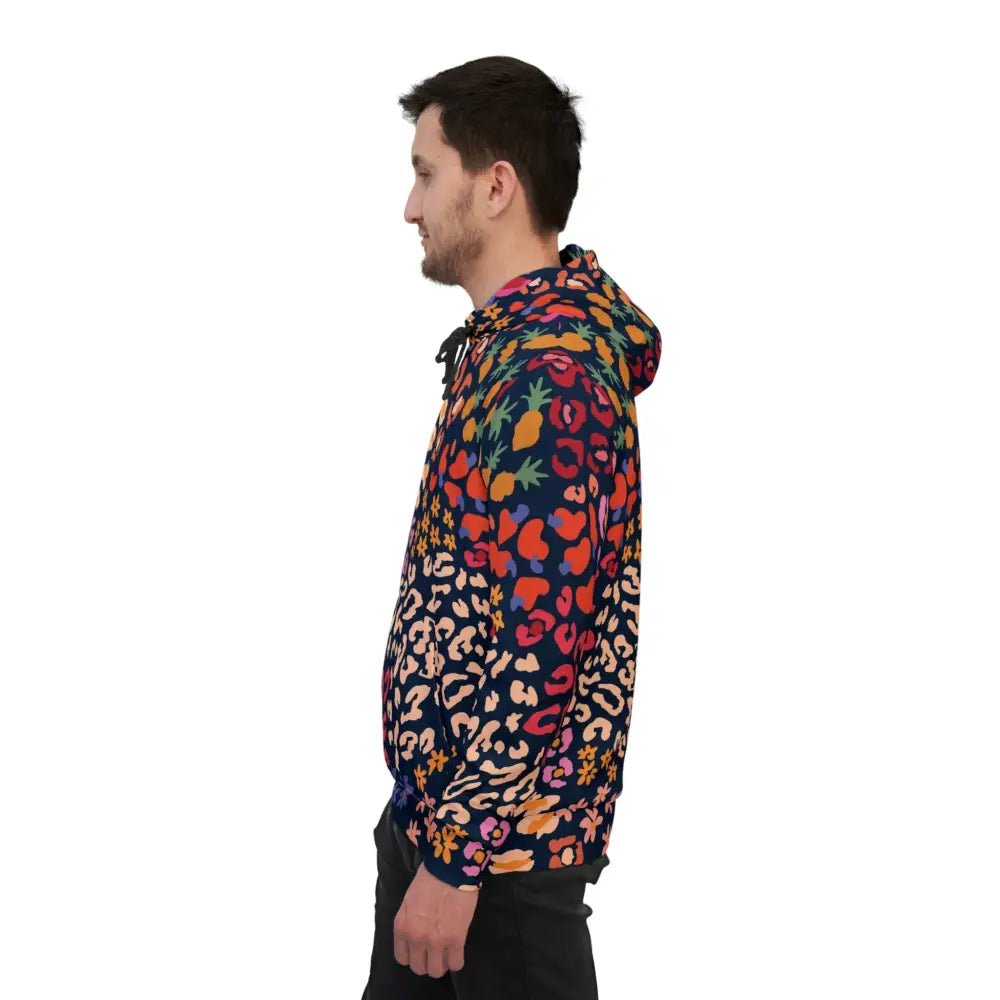 Man wearing a colorful patterned hoodie from PixiOnyx Chromapulse Spots Streetwear collection