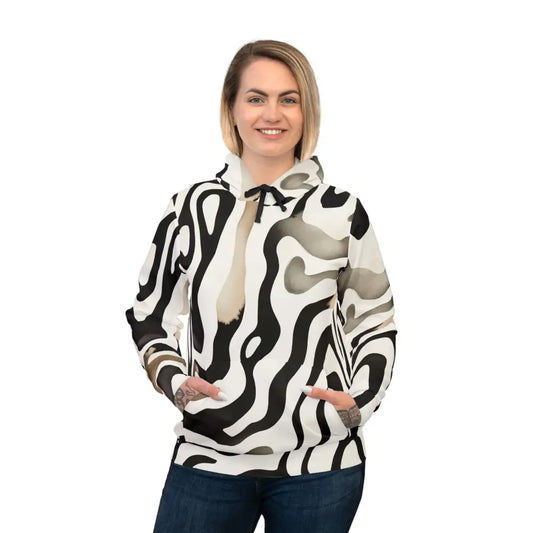 Woman wearing a black and white patterned unisex hoodie from PixiOnyx Surreal Patternwear