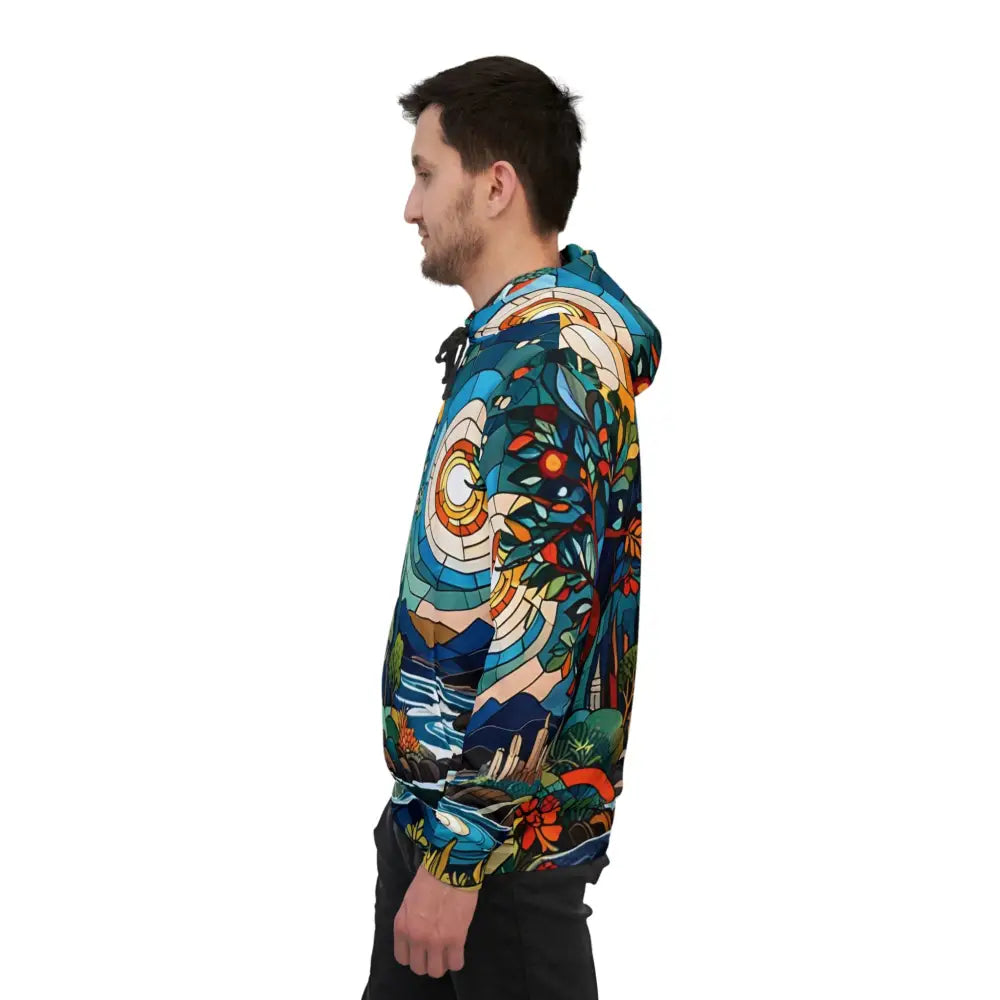Man wearing a colorful hooded sweatshirt from PixiOnyx Prism Realms Stained Horizon collection