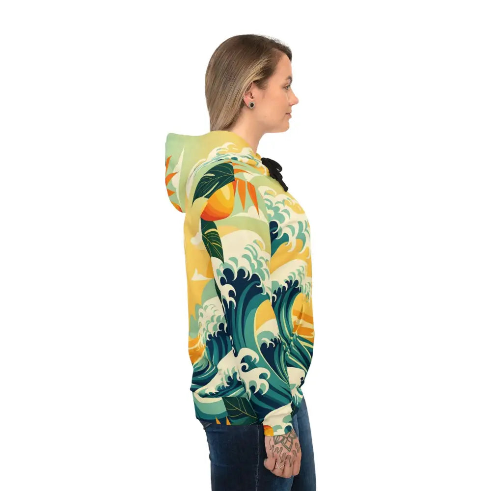Woman wearing a patterned hoodie from PixiOnyx Mango Coastwear Tropical Wave collection