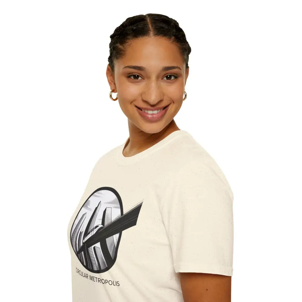 Woman wearing a cream-colored unisex softstyle t-shirt with Circular Metropolis graphic