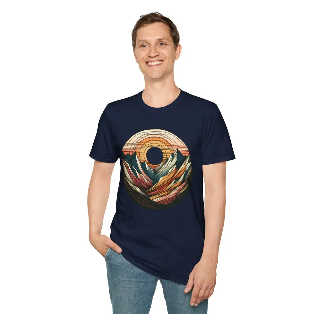 Man in navy blue softstyle t-shirt with colorful mountain and sunset graphic, eco-friendly design