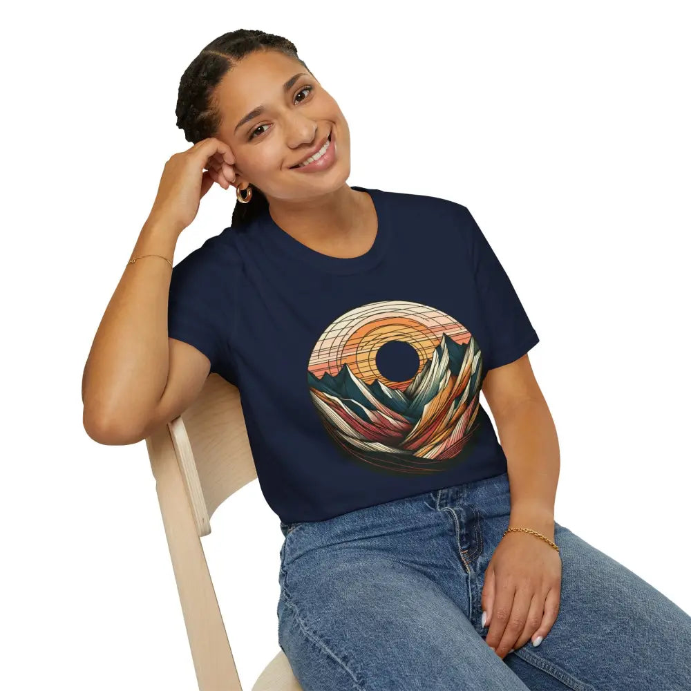 Woman wearing navy Vintage Mountain Vibes softstyle t-shirt with colorful mountain sunset graphic